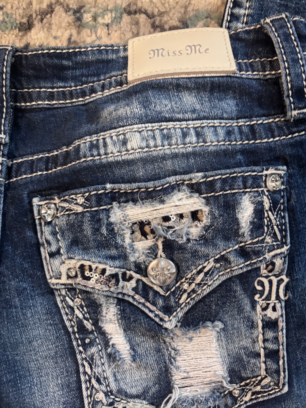 Miss Me Los Angeles Distressed Blue Midrise Boot Cut w/Silvery Glitter on Pocket